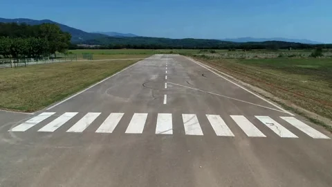 Airport: take off aerial point of view of the runway Stock Footage