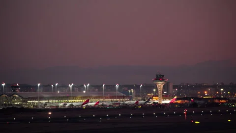 Airport Terminal and Control Tower at Twilight Stock Footage 335273995