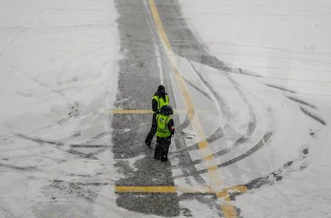 Airport Workers Having a Chat While Waiting for the Airplane in Bad Weather Stock Photos