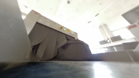 Airport X-Ray security scanner POV as camera emerges through rubber flaps v2 Stock Footage 118208681