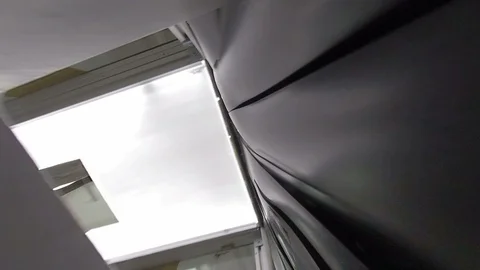 Airport X-Ray security scanner POV as camera goes through rubber flaps Stock Footage 118253798