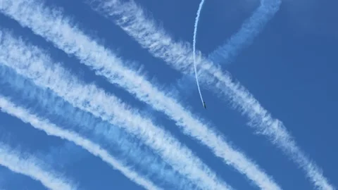 Airshow acrobatics with planes creating thick white smoke trails in clear b.. Stock Footage 333827489