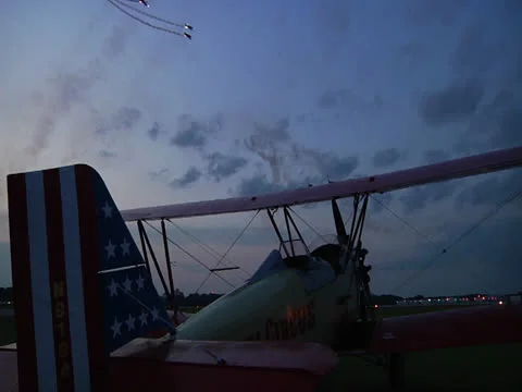 Airshow with Biplane in foreground Stock Footage 24655395