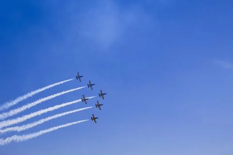 Airshow with planes in the cloudy sky Stock Photos
