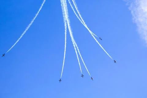 Airshow with planes in the cloudy sky Stock Photos