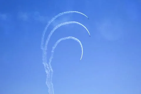 Airshow with planes in the cloudy sky Stock Photos