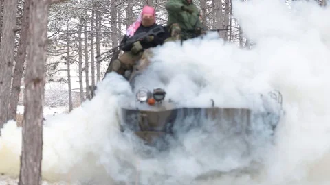 Airsoft. Afghan Armed Forces. two soldiers riding in armored personnel carriers Stock Footage 127956300