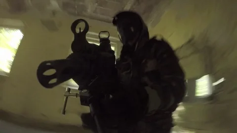 Airsoft, climbing throuh a hole Stock Footage 80821924