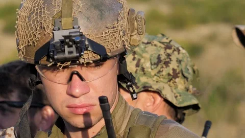 Airsoft. Combat operation. A young soldier in helmet and glasses Stock Footage 128653047