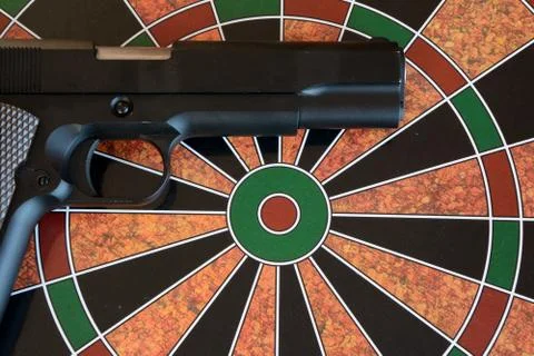Airsoft gun on target - dartboard Stock Photos