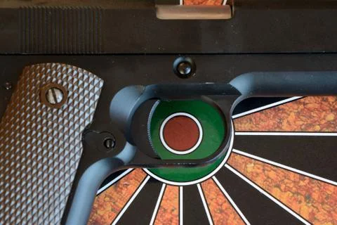 Airsoft gun on target - dartboard Stock Photos