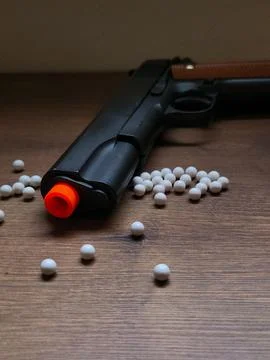 Airsoft gun with white pellets Stock Photos