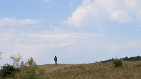 Airsoft. One soldier on the battlefield. An armed man stands on guard 스톡 동영상 129068853