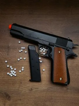 Airsoft pistol with ammunition Stock Photos