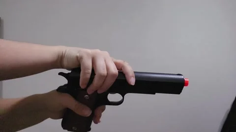 Airsoft Pistol Loading and Single Shot in Slow Motion Stock Footage 326703154