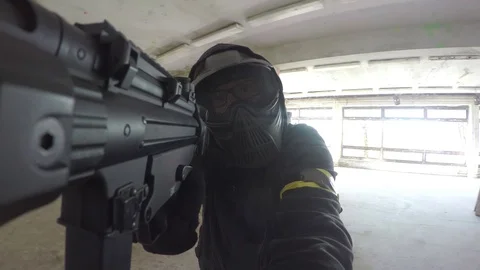 Airsoft player shooting Stock Footage 74299577