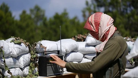 Airsoft. Radar base in forest. Afghan soldier selects a radio wave. Stock-Footage 127920132