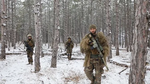 Airsoft. Soldiers attacking enemy, rifles ready to shoot. Military camouflage. Stock Footage 127977577
