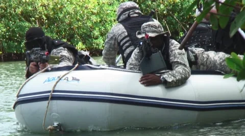 Airsoft tactical team training on a dingy on sea 2 Stock-Footage 40331878