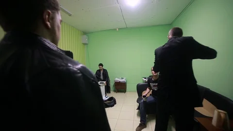 Airsoft. Two armed men pointing guns at two people who count the money. Mafia Stock Footage 130115480