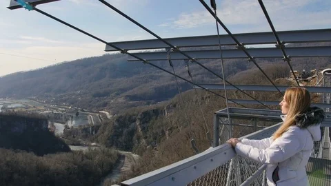 Airy pedestrian bridge construction over abyss, skybridge observation deck Stock Footage 71706714