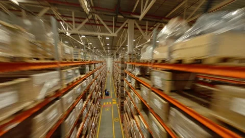 Aisle between high racks with packed products in warehouse Stock Footage 204915625