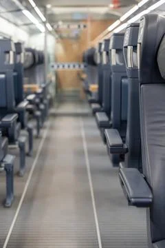 Aisle in the first-class train with blurred background effect. Stock Photos