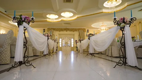 Aisle with flower decor between tables in banqueting hall Stock Footage 215669750