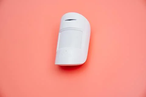 Ajax. motion sensor on pink. device that tracks movement of objects. Stock Photos