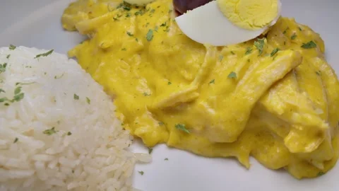 Aji de Gallina served on a bed of rice. Typical Peruvian food Video stock 340053379