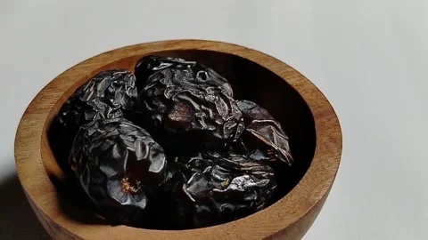 Ajwa dates, known as the Prophet's dates, in an aesthetic wooden container. Stock Footage 330039306