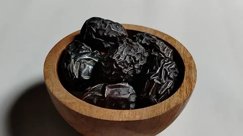 Ajwa dates, known as the Prophet's dates, in an aesthetic wooden container. Stock Footage 330039312