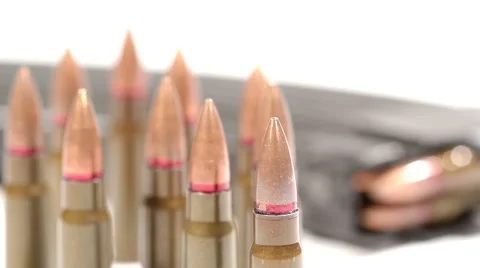 AK-47 ammunition. Defocus from a bunch of upright bullets in the front 動画素材 60066577
