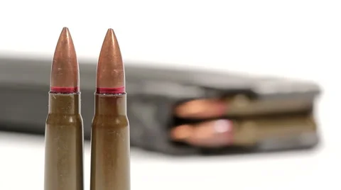AK-47 ammunition. Defocus from two of upright bullets in the front Stock Footage 60066698