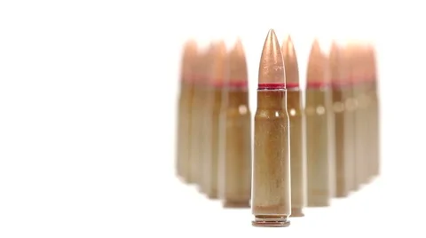 AK-47 ammunition. Tilt up from a diagonal bunch of upright bullets Stock Footage 60639115