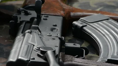 Ak 47 on front line rack focus Stock Footage 49413014