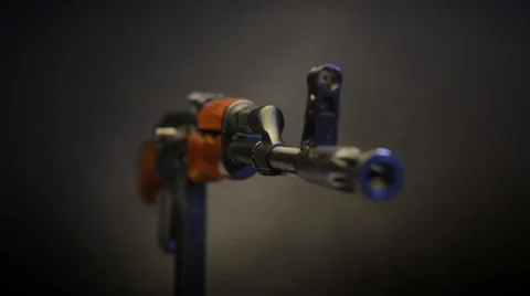 Ak47 on stand angled  rack on muzzle Video stock 36614961