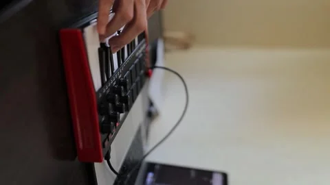 AKAI MPK Mini 3 Midi Keyboard. Man hands playing AKAI MPK Mini Keyboard. Stock Footage 248635918