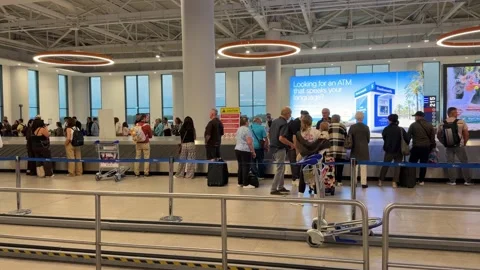 Aksu, Turkey - September 04, 2026: Travelers waiting in line at airport Stock Footage 345667455