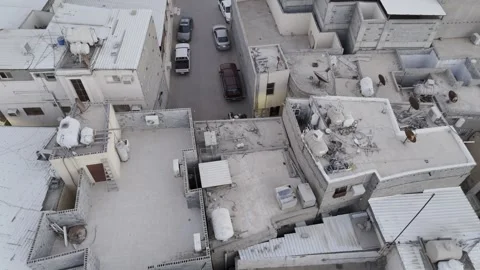 AL AHSA, SAUDI ARABIA – AUGUST 9, 2026: Aerial Reveal of Traditional Homes Stock Footage 341844004