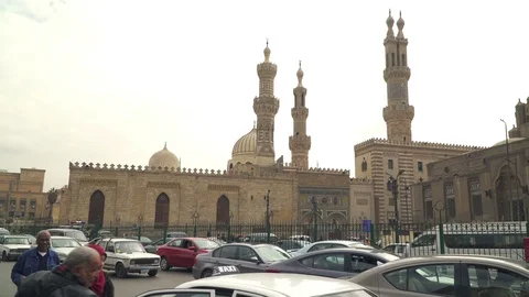 The Al Azhar mosque at sunset and car traffic in Islamic Cairo, Egypt Stock Footage 127795447