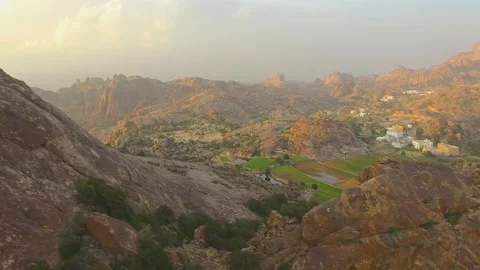 Al-Ula, Saudi Arabia. Overlooking the mountain valley landscale, and oasis Stock Footage 106655513