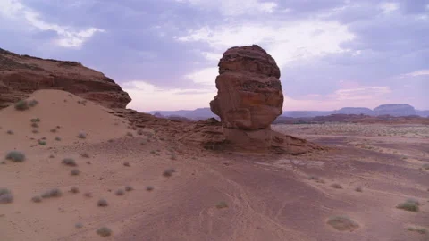 Al Ula, Saudi Arabia. Pull back from mountain rock. Desert background. Aerial 4K Stock Footage 196847648