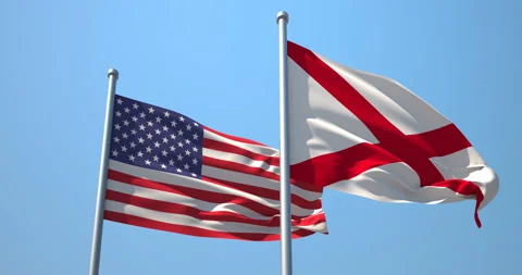 Alabama flag and the USA on a flagpole. Stock Footage