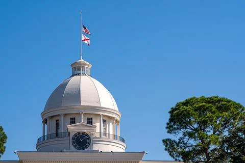 Alabama State Capitol Dome with Flags Under Clear Blue Sky Stock Photos