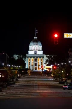 Alabama State Capitol Viewed Down City Street at Night in Montgomery, AL Stock Photos