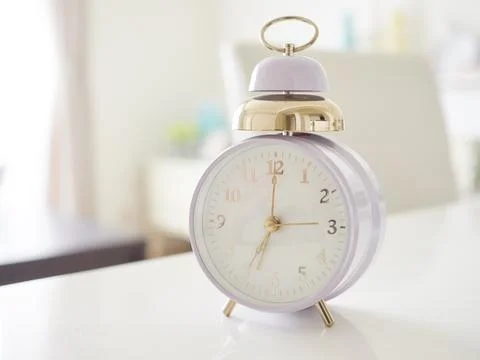 Alarm clock at 7 a.m. Stock Photos