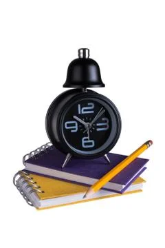 Alarm clock above spring notes Stock Photos