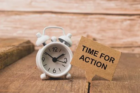 Alarm clock and bubble speech note written with TIME FOR ACTION Stock Photos