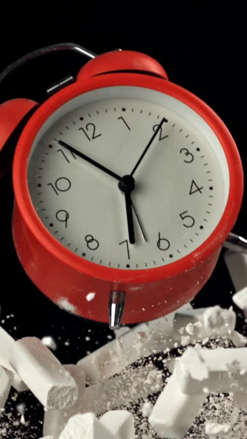 Alarm clock and school crayons fly up on a black background. Filmed on a high Stock Footage 335377247